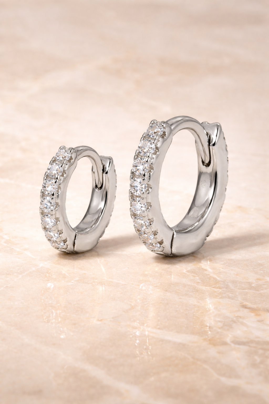 Double ear piercing sterling silver pavé huggie set with 6.5mm and 8.5mm white CZ stones