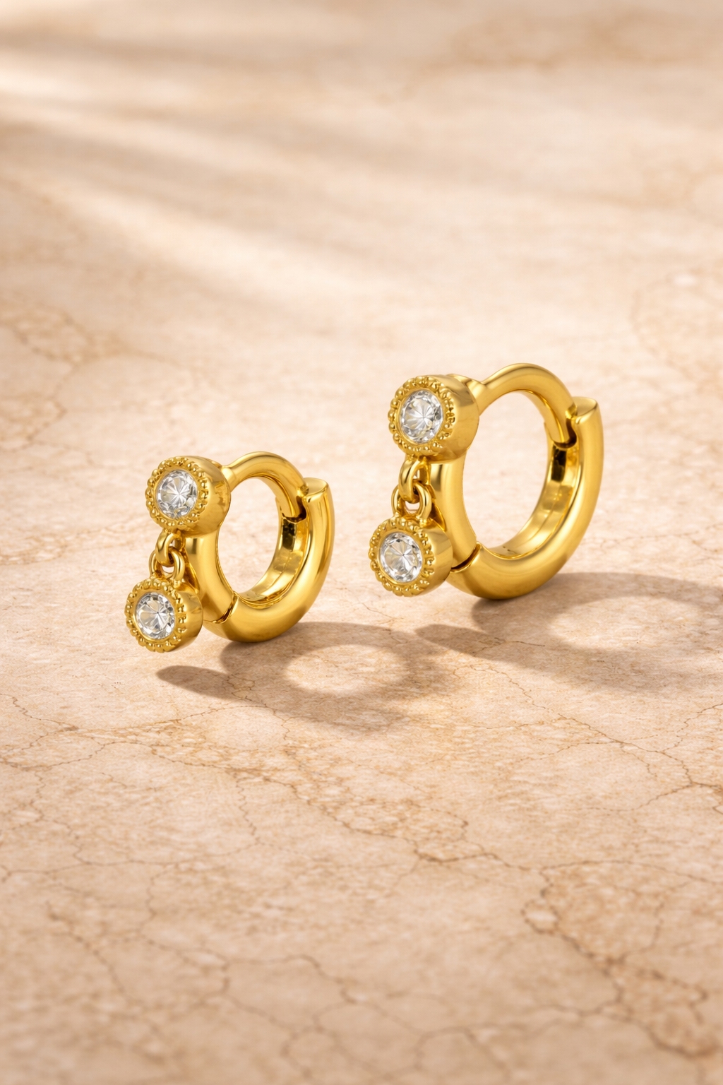 Double ear piercing gold vermeil huggie set with 6.5mm and 8.5mm simple shaker hoops and white CZ stones