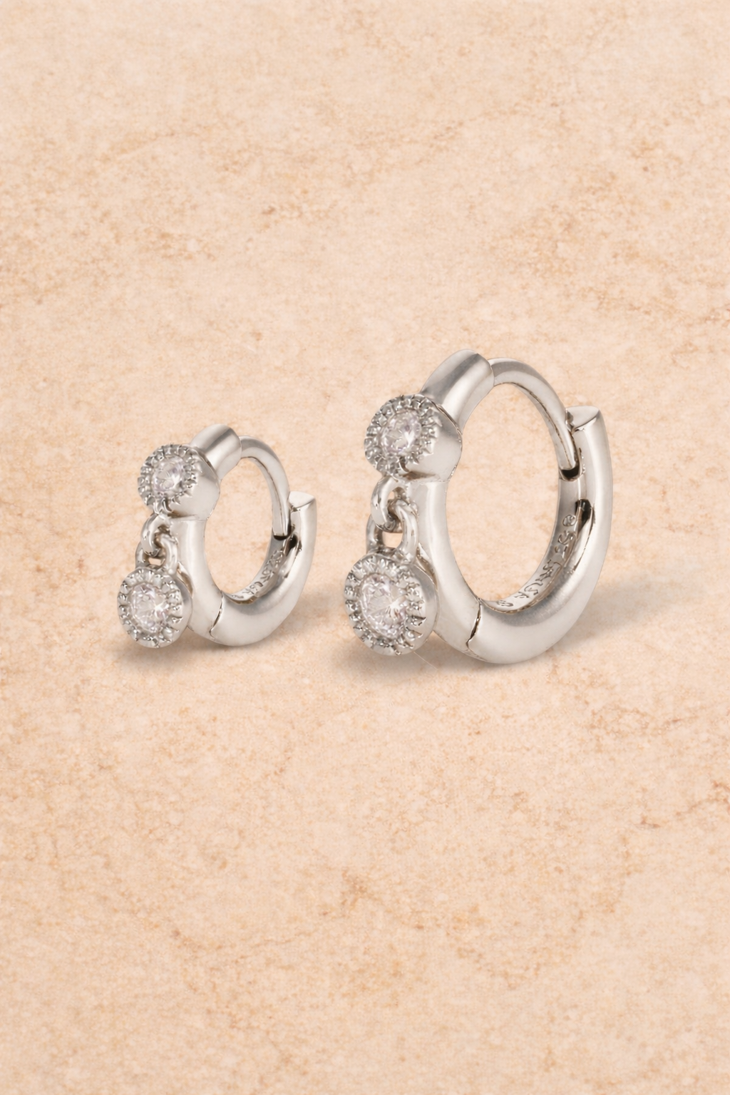 Double ear piercing sterling silver huggie set with 6.5mm and 8.5mm simple shaker hoops and white CZ stones