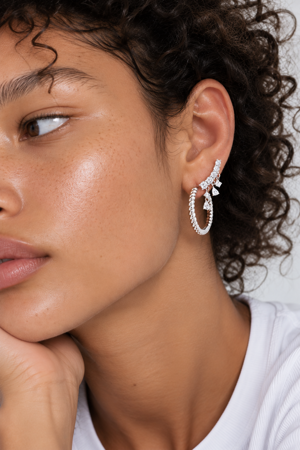 Silver ear stack by Galleria Armadoro featuring the Speira 18 mm hoop and Droppy Croissant earring for a sculptural statement look.