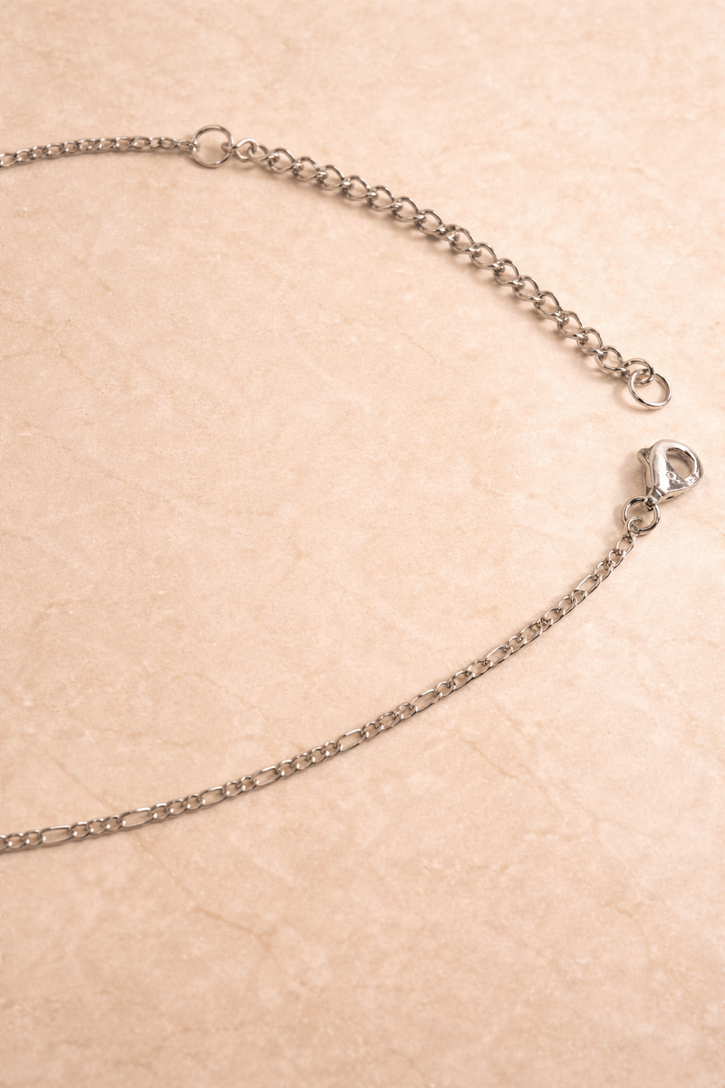 Speira red coral sterling silver charm necklace laid flat, showing Scarlett chain and adjustable 40 cm + 5 cm extender