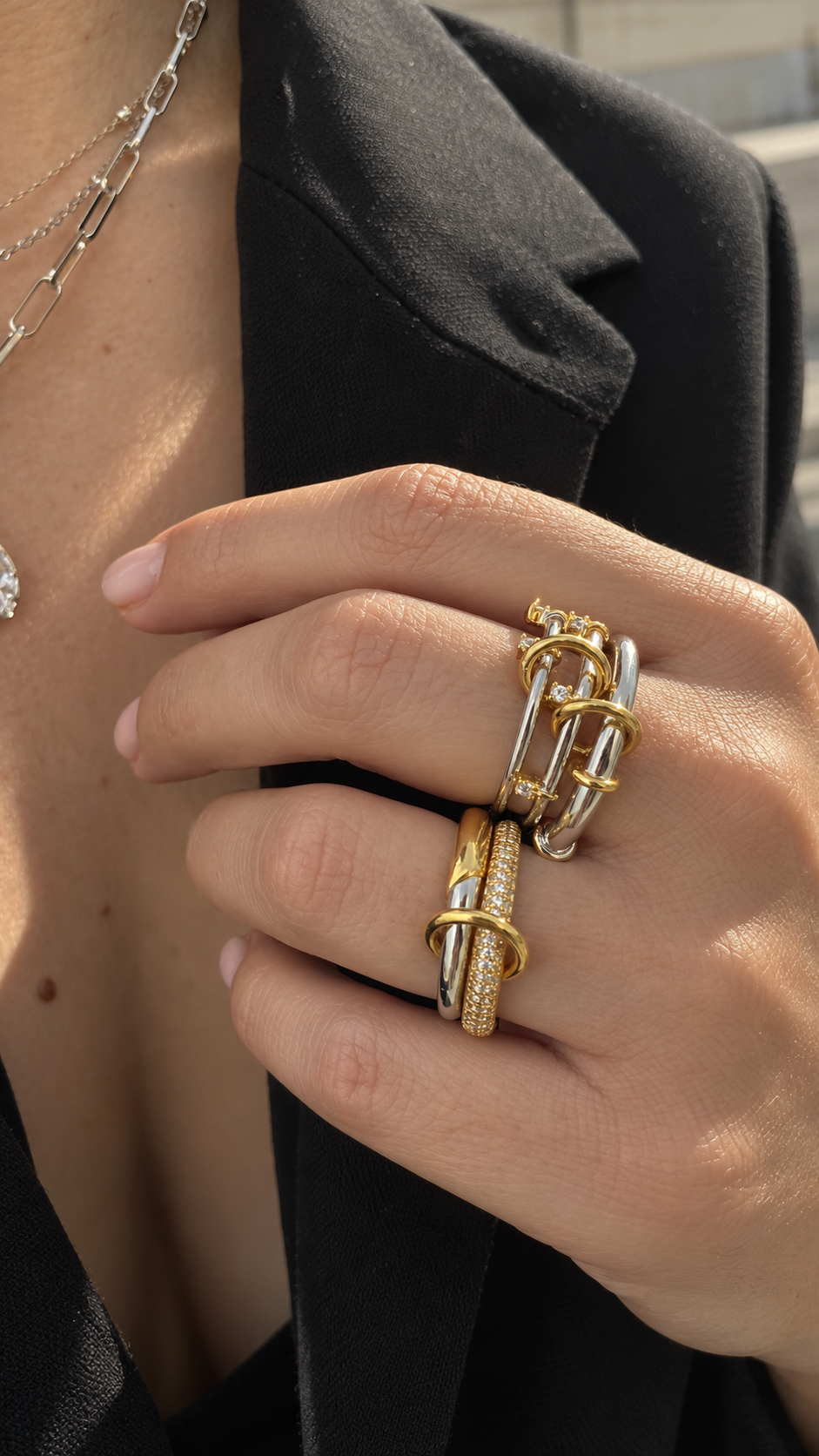 Mixed-metal linked ring stack by Galleria Armadoro featuring sculptural gold, silver and pavé rings styled together.