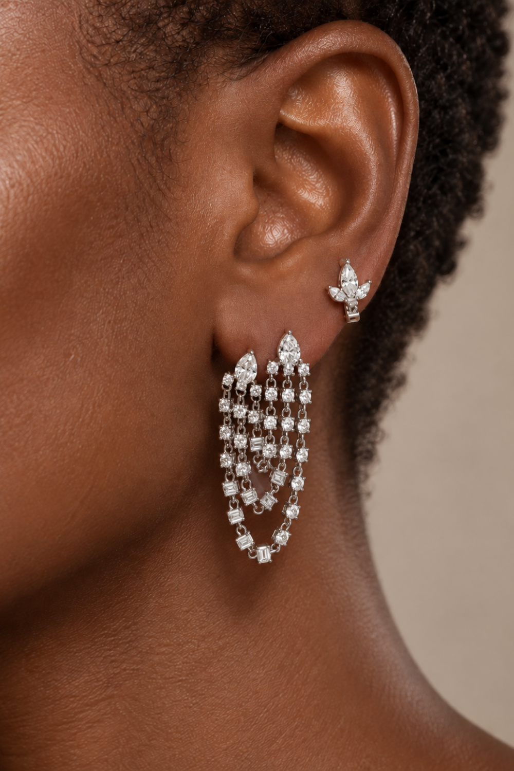 Silver ear stack by Galleria Armadoro featuring the Super Rosie drop earring at the lobe and the Lotus Stud styled on the mid helix.