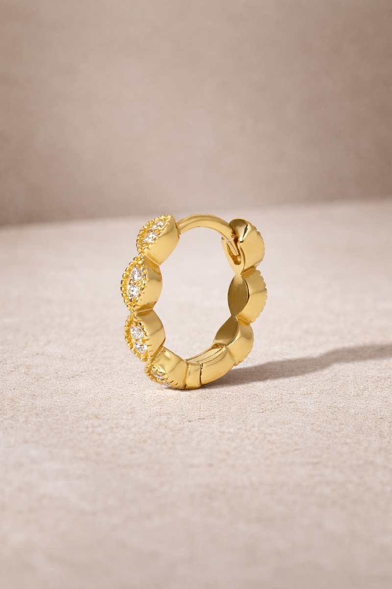 Tasha 8.5mm gold vermeil huggie earring with white CZ stones, single hoop, front view -->
