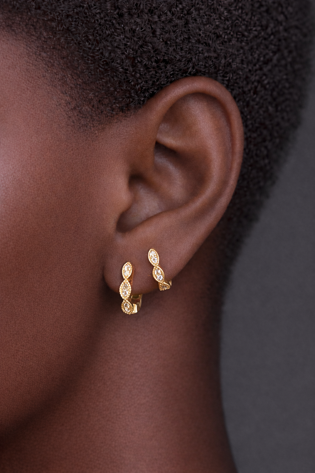 Two earrings in one ear styling with Tasha gold pavé huggies for second ear piercings