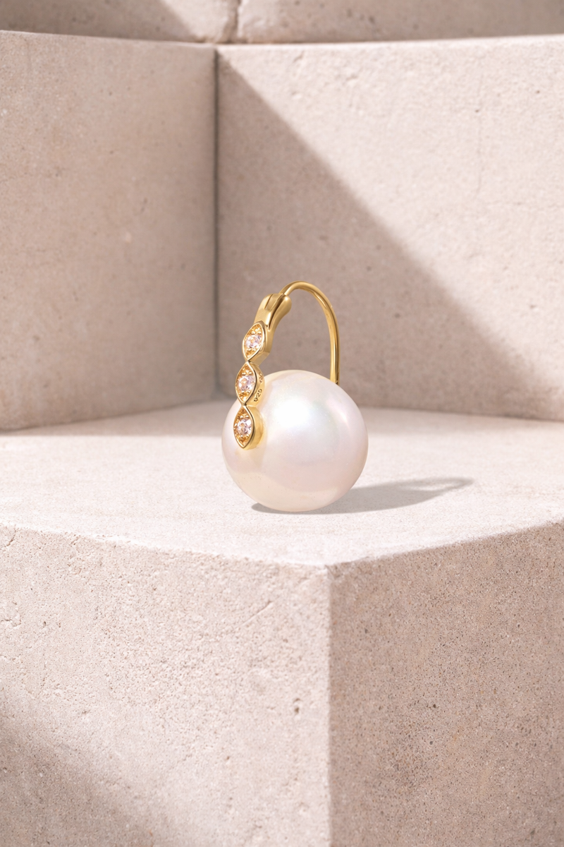 Tasha Pearl gold vermeil mini hoop earring with 11mm white pearl and pavé CZ detailing on neutral studio background