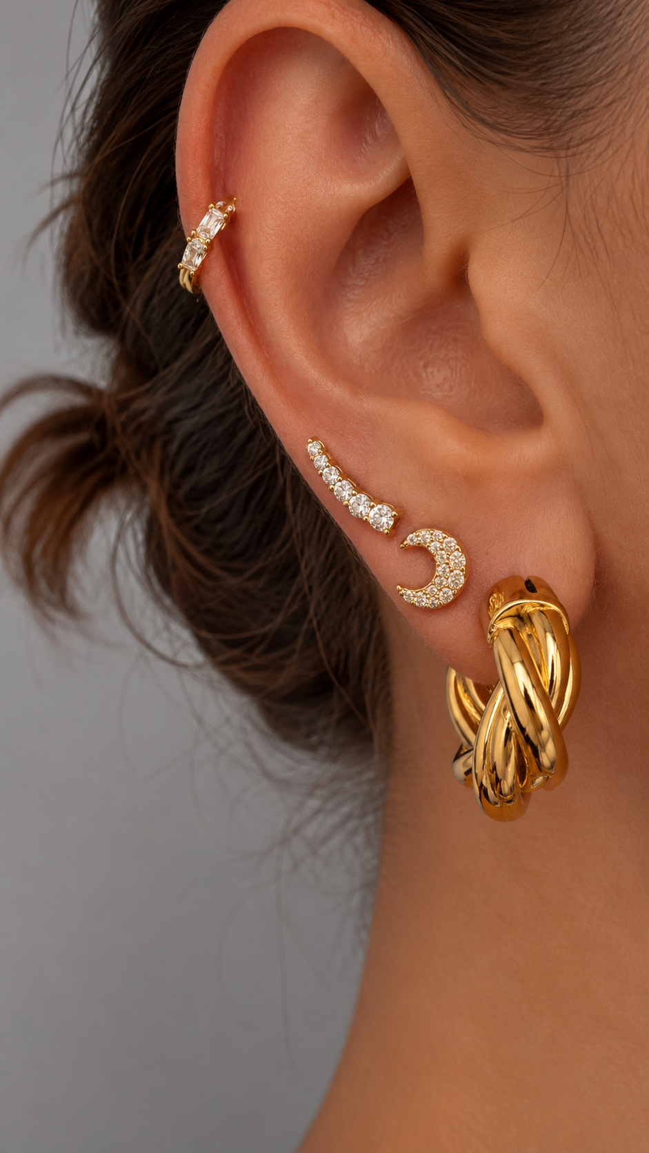 Gold stacked ear look by Galleria Armadoro featuring 2 cm Tina Hoops with pavé earrings and piercing jewellery.