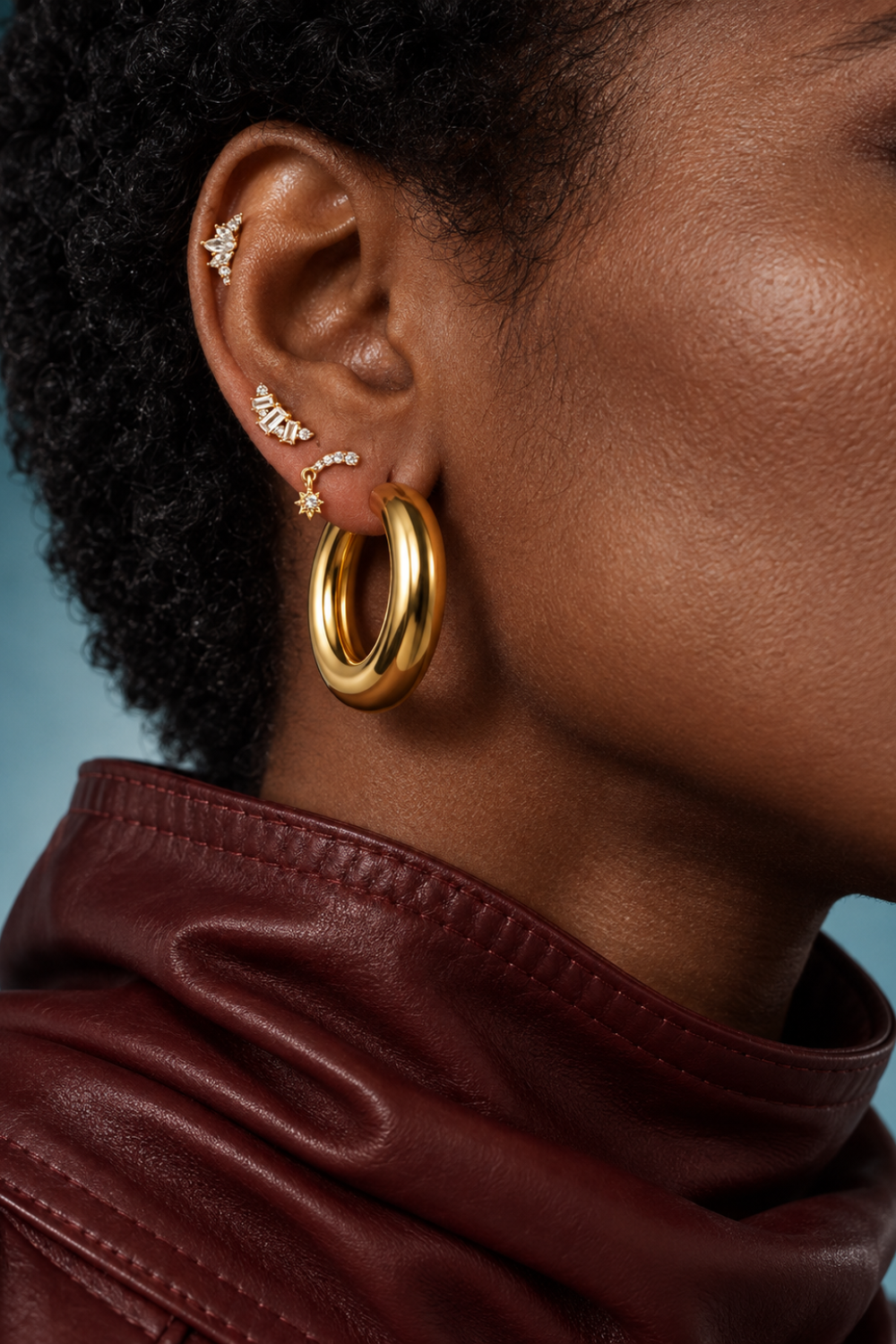 Gold ear stack by Galleria Armadoro featuring a statement Gaga Hoop with delicate crystal studs layered up the ear.