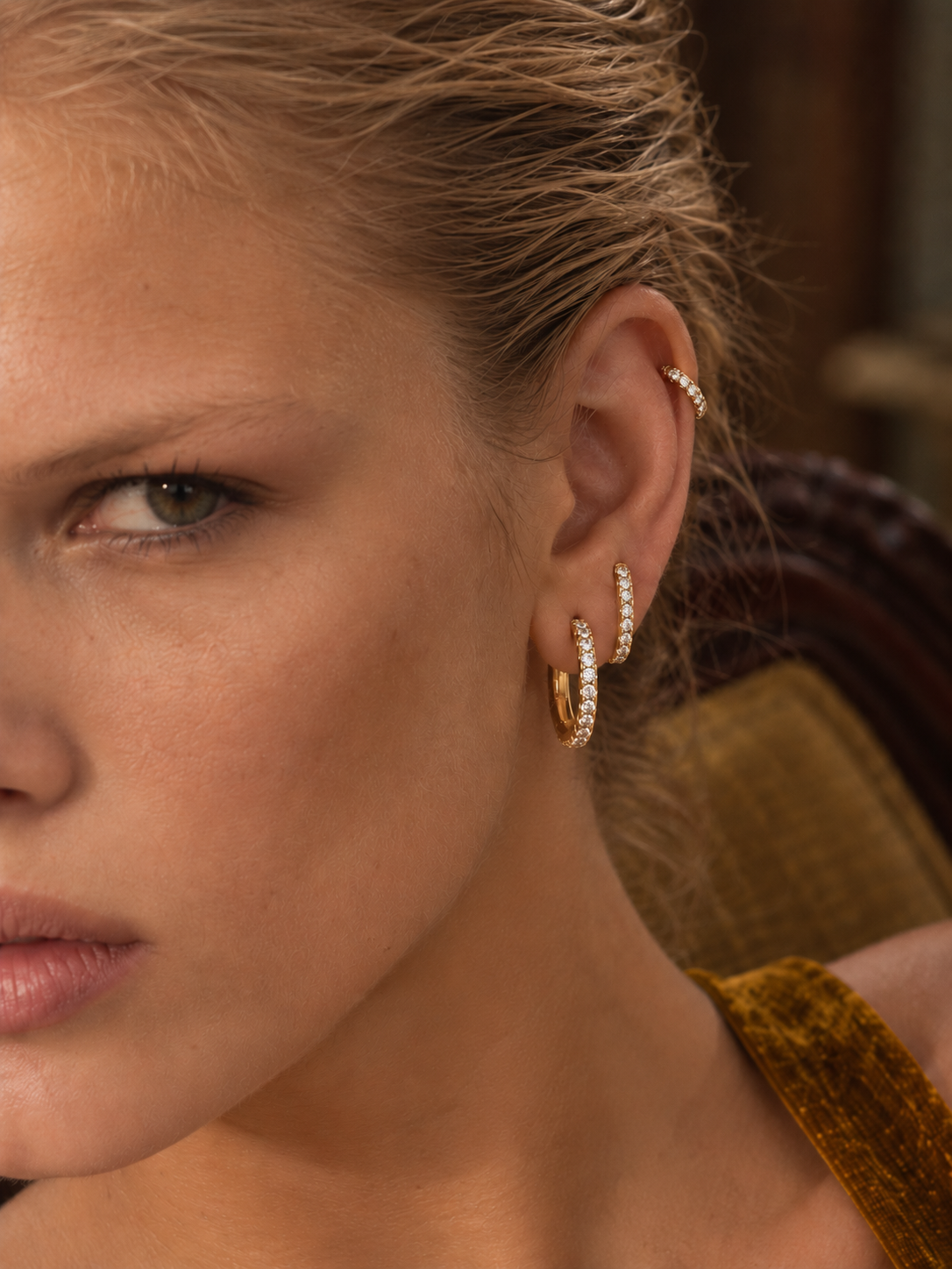 Graduated gold ear stack by Galleria Armadoro featuring pavé hoops in descending sizes with a delicate gold ear cuff.
