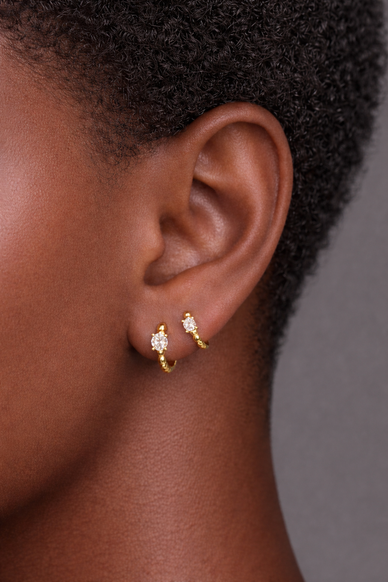 Two earrings in one ear styling with Bubbles gold vermeil huggies 6.5mm second piercing and 8.5mm first piercing