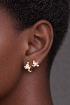 Two earrings in one ear styling with lotus gold vermeil huggies for second ear piercings and multiple ear piercings