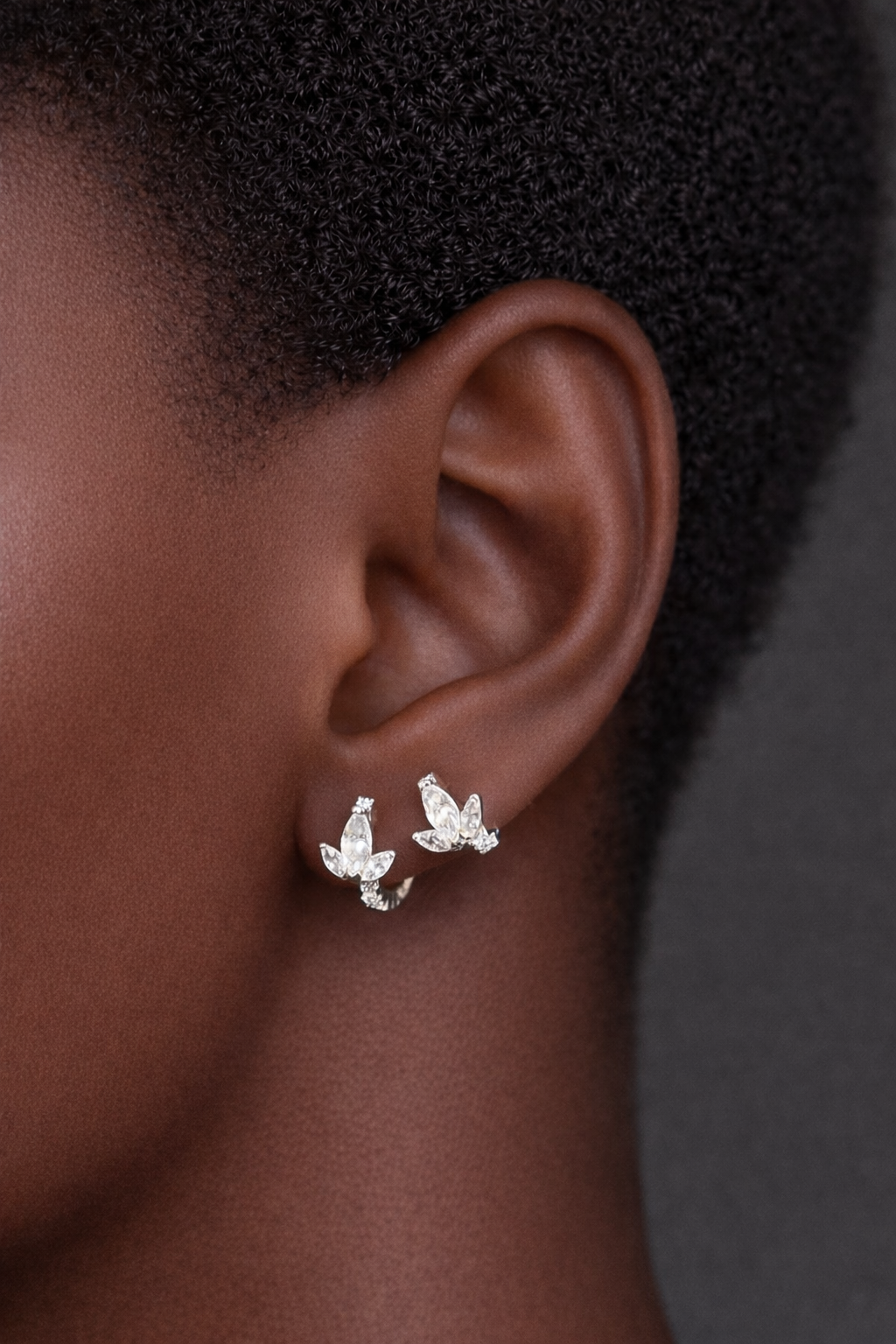 Two earrings in one ear styling with lotus sterling silver huggies for second ear piercings