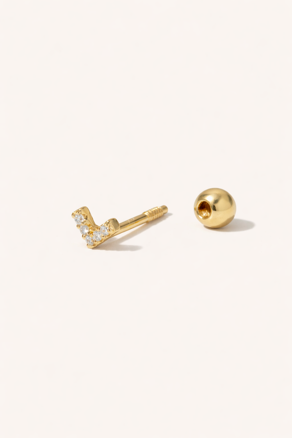 V-shaped gold vermeil stud earring shown unscrewed with threaded post and hollow ball screw backing