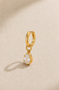 Shop the 6.5mm gold huggie earring set with Vittoria gold charm. 925 sterling silver, 24ct gold plating, hypoallergenic and perfect for cartilage and upper lobe piercings.