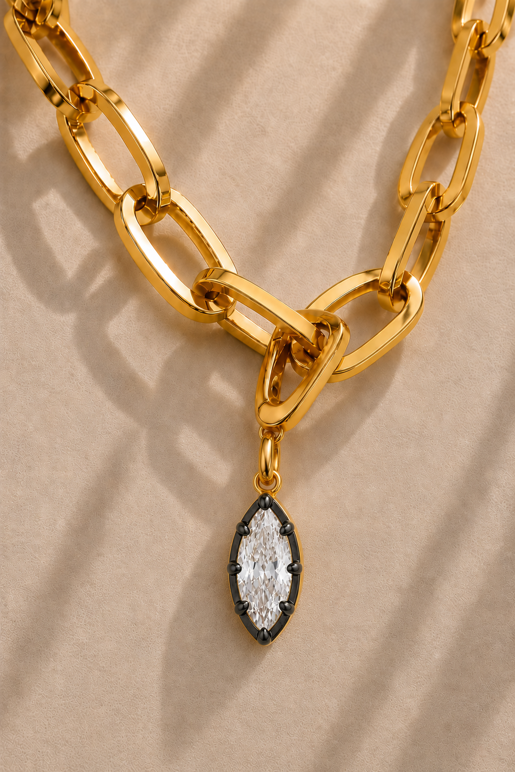 Cara chunky gold paperclip necklace with Vittoria black and gold marquise crystal charm