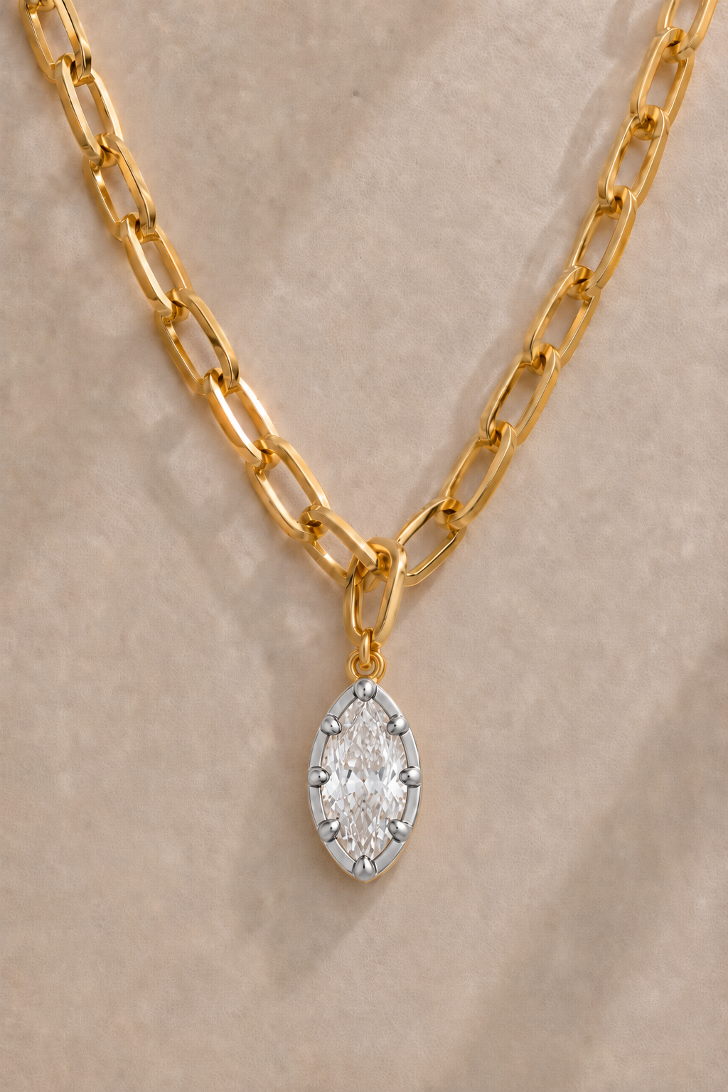 Cara chunky gold paperclip necklace with Vittoria silver and gold marquise crystal charm