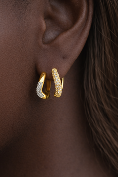 Amara Kyma two tone huggie styled with Aurora Kyma sister huggie in stacked ear look