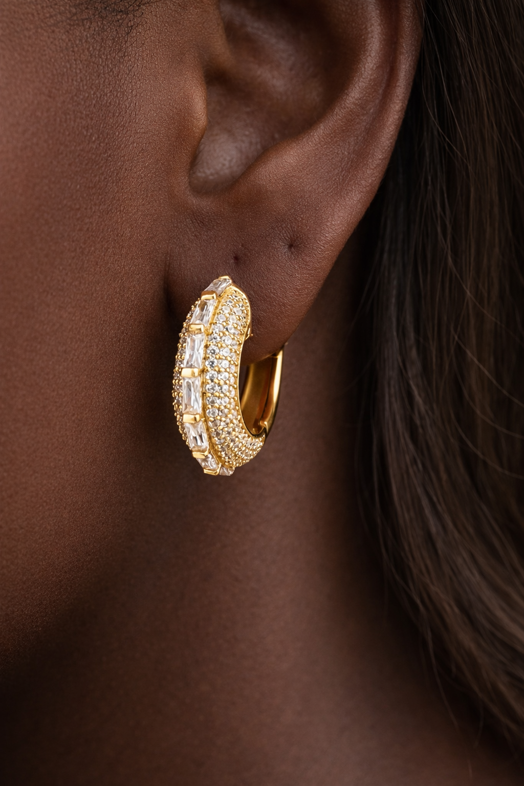 Arabella Mini Single Hoop worn on ear in 24ct gold plated 925 sterling silver with baguette and micro pavé stones