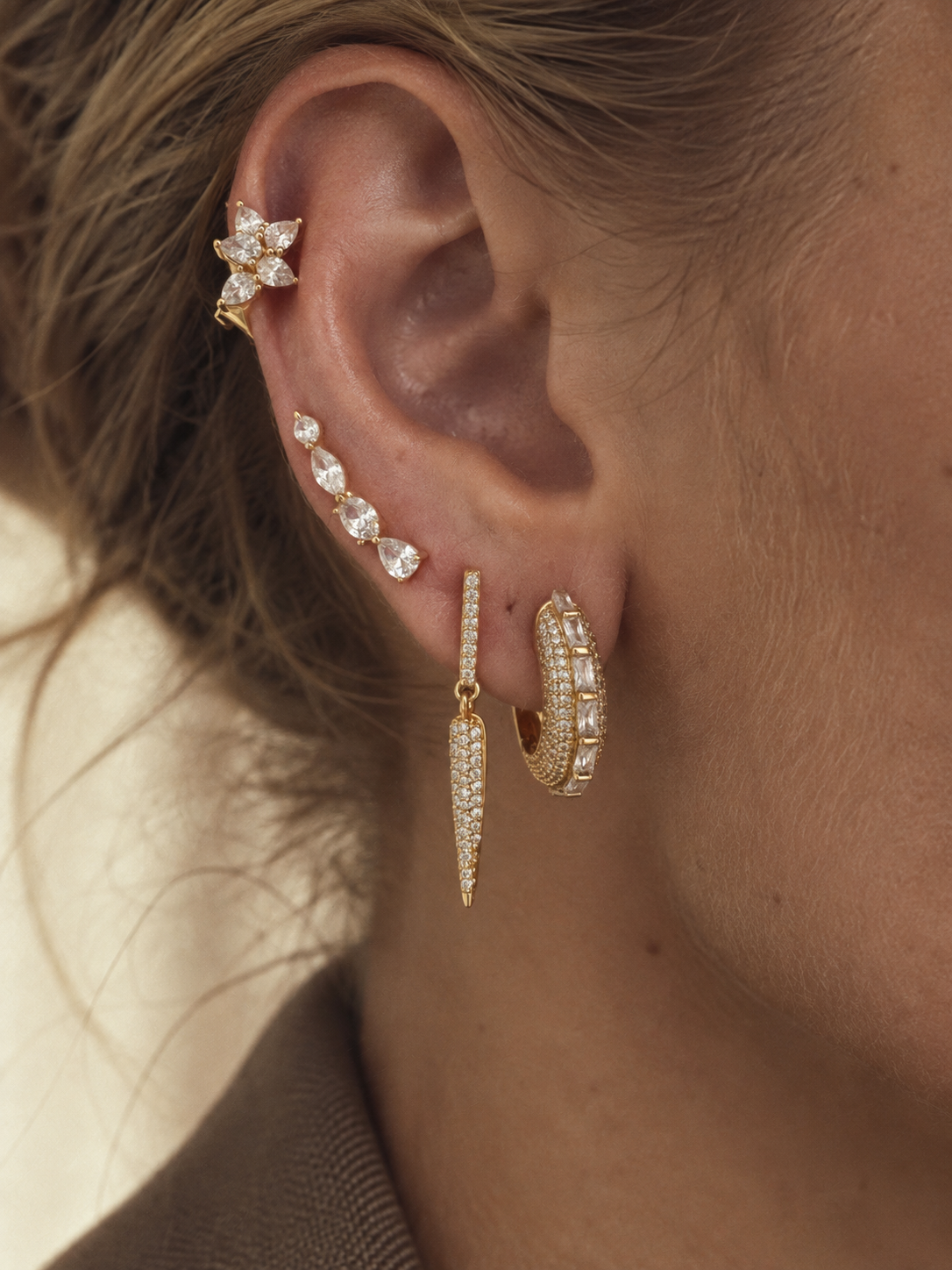 Gold ear stack by Galleria Armadoro featuring the Arabella Gold Pavé & Baguette Hoop with crystal drop and marquise ear jewellery.