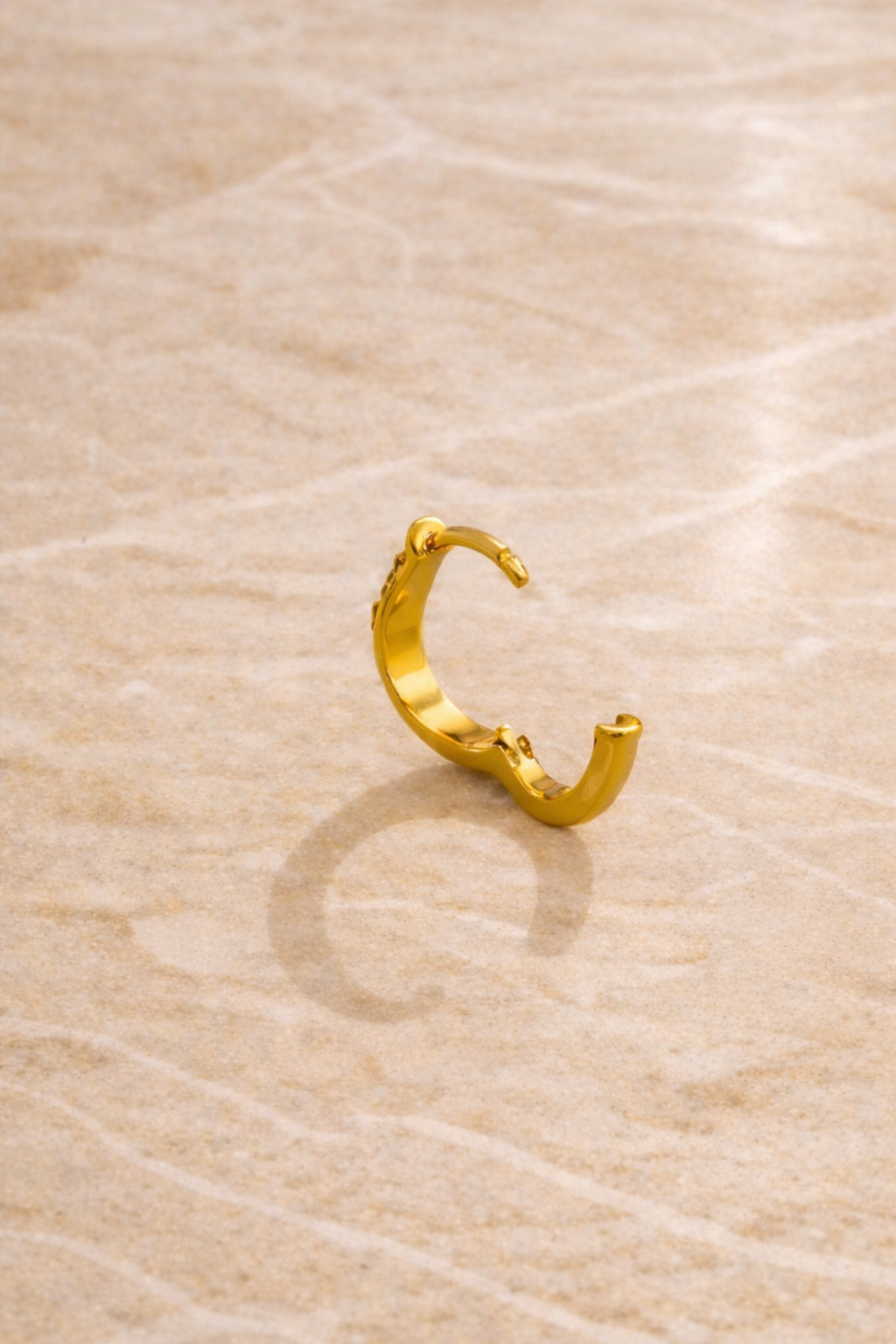 Back view of Aurora Kyma huggie earring showing hinged closure