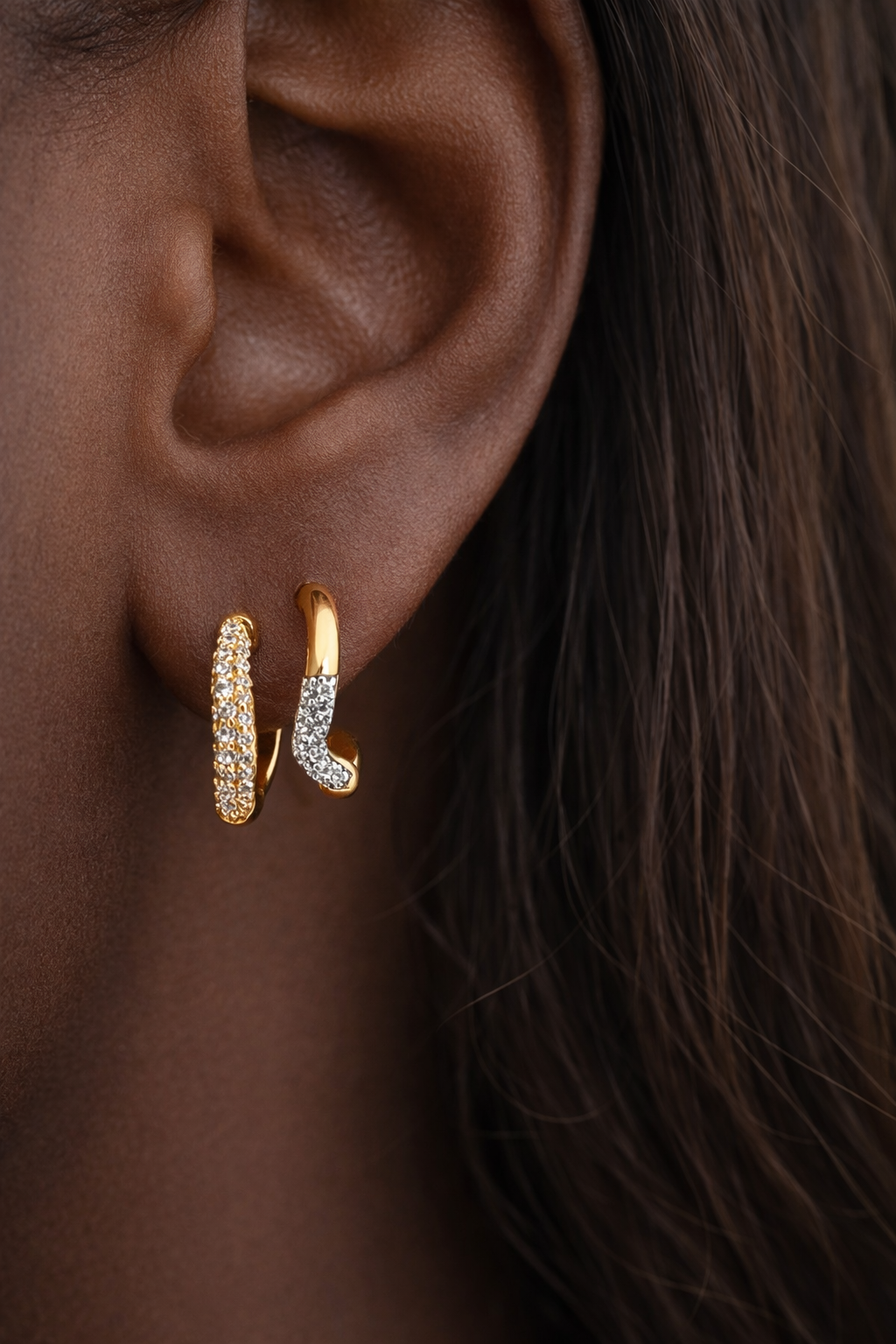 Amara Kyma two tone huggie styled with Aurora Kyma sister huggie in stacked ear look