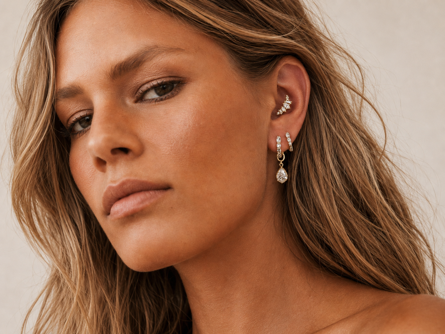 Gold ring stack styled by Galleria Armadoro with sculptural rope rings, polished gold bands and pavé details.
