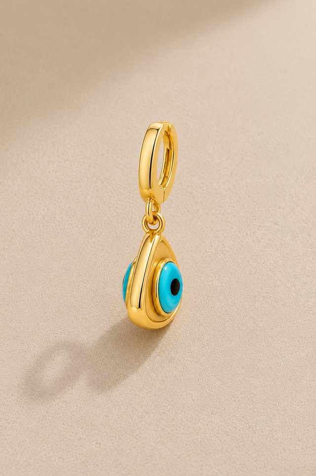 Side view of gold evil eye hook charm showing double-sided turquoise eye detail