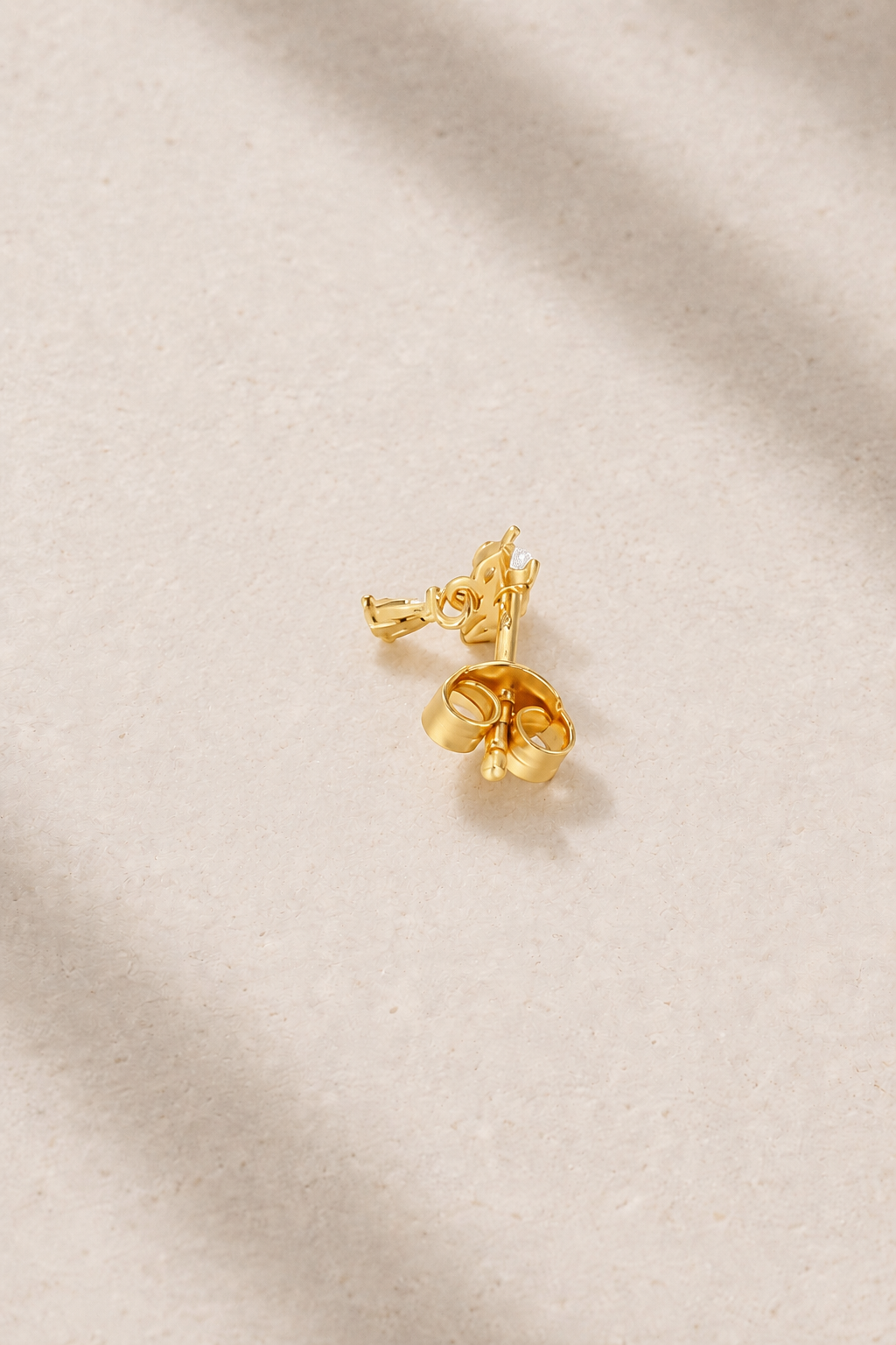 Back view of Fleur Gold Stud Earring with butterfly post fastening