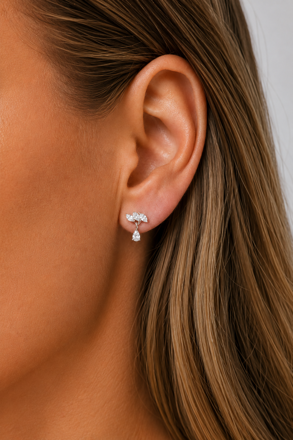 Fleur Silver Stud Earring worn on ear with delicate white CZ sparkle