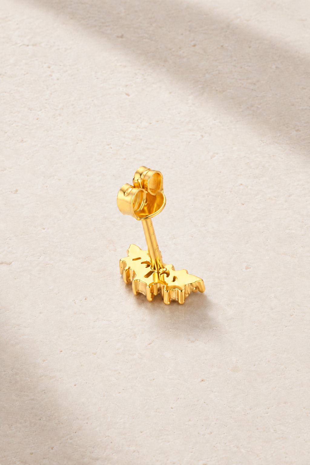 Back view of Lumière Gold Stud Earring with butterfly post fastening