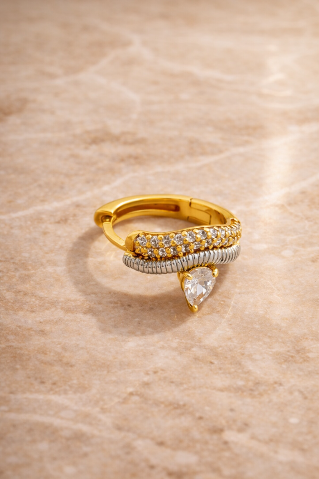 Side view Maura huggie earring 10mm inner diameter mixed metal gold and silver