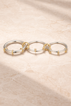 Clara mixed-metal multi-band ring with polished silver-tone loops and gold accents