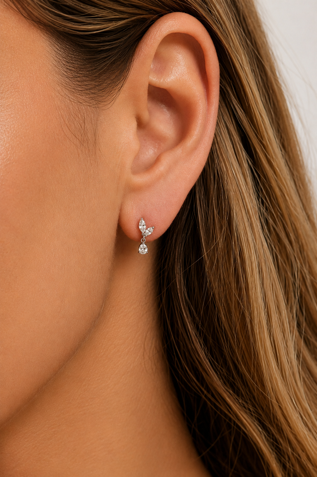 Papillon Silver Stud Earring worn on ear with delicate white CZ sparkle
