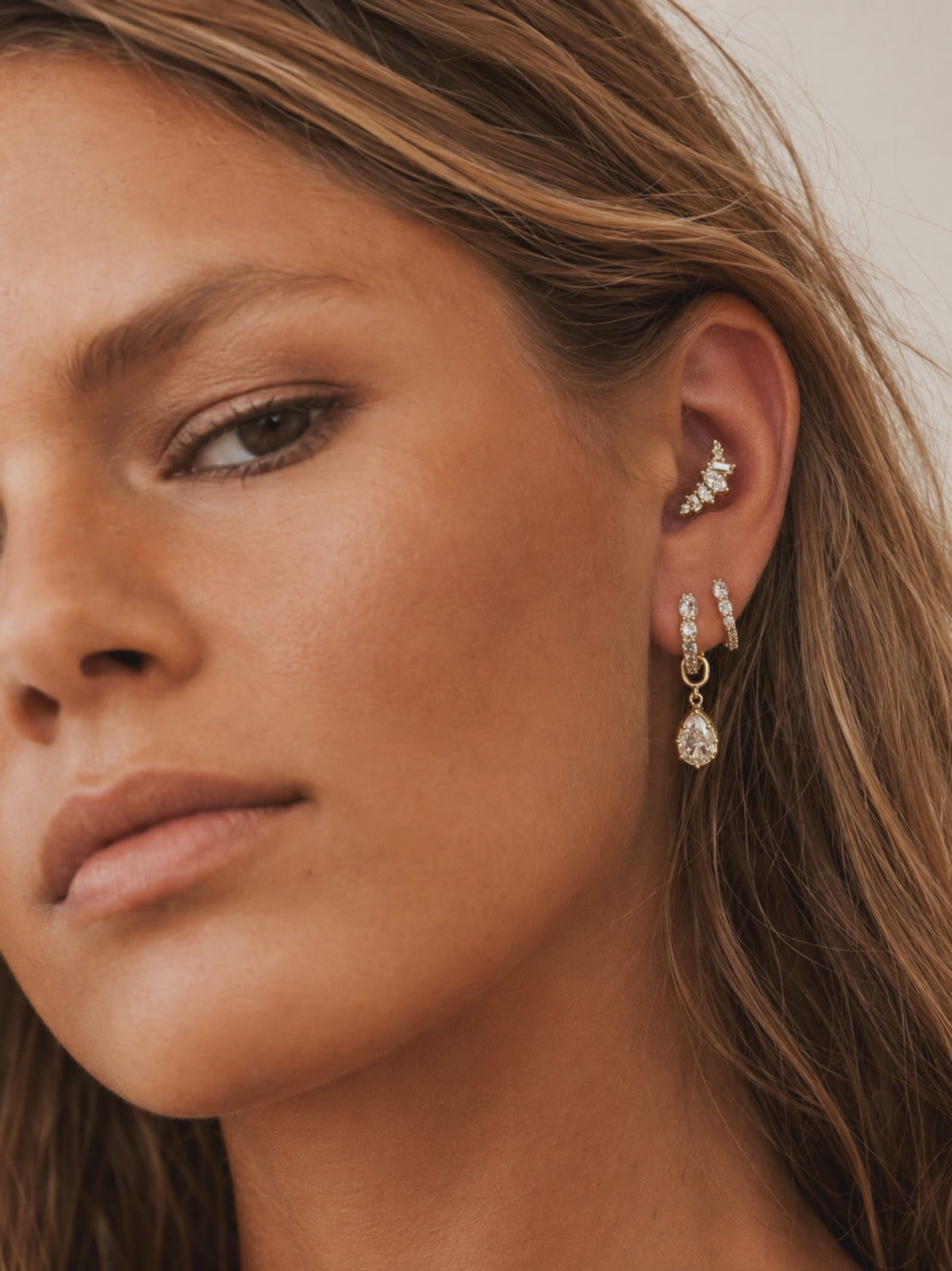 Gold ring stack styled by Galleria Armadoro with sculptural rope rings, polished gold bands and pavé details.