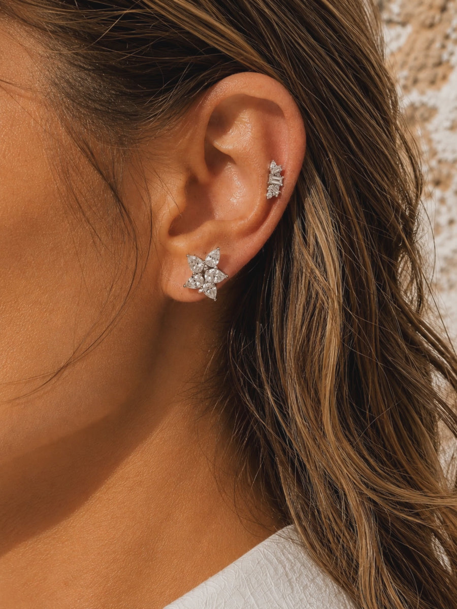 Silver ear stack by Galleria Armadoro featuring Odette and Lumière, styled in warm sunlight.