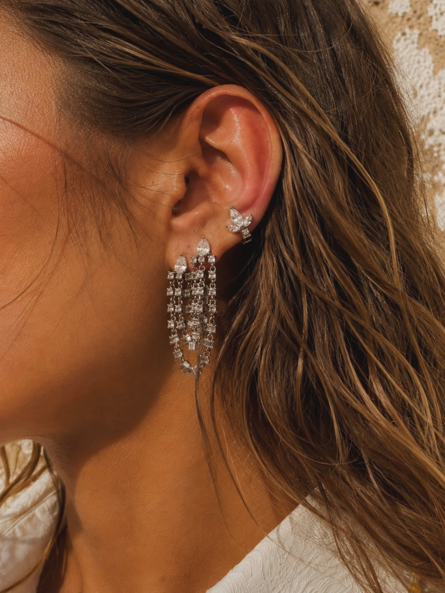 Statement silver ear stack by Galleria Armadoro featuring the Super Rosie earring with a marquise ear detail in warm sunlight.