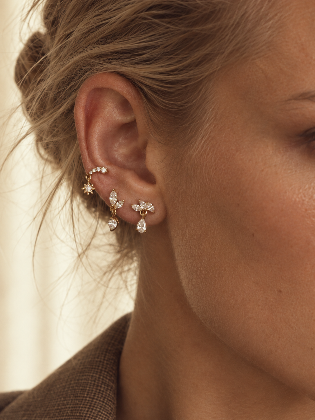 Delicate gold stud ear stack by Galleria Armadoro featuring pavé, marquise and pear-shaped earrings in a refined all-studs styling.