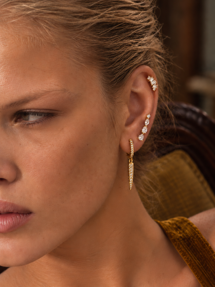Gold ear stack by Galleria Armadoro featuring the Long Spear drop earring, Riviera Ear Climber and Lumiere on the helix.