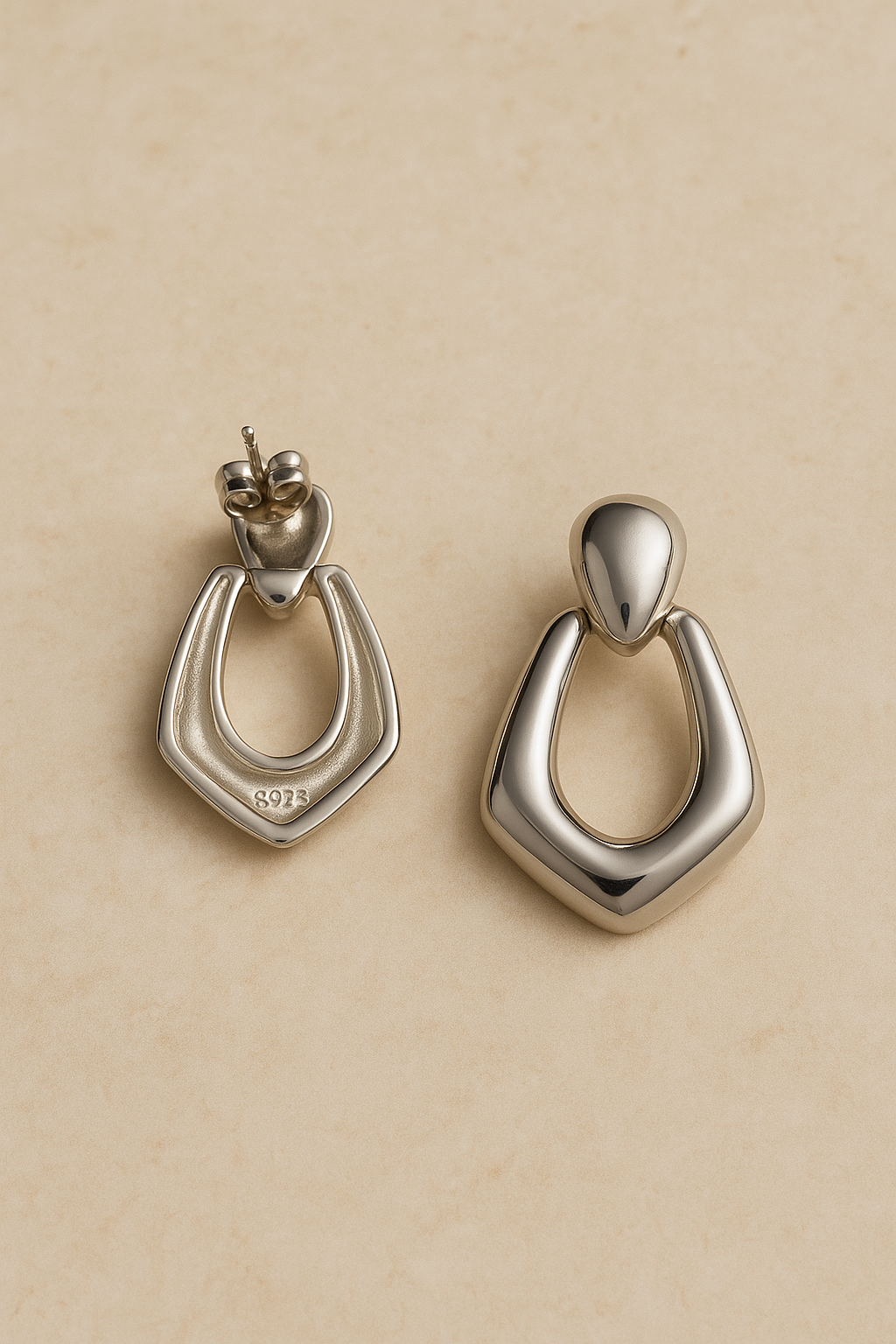 Back and angled view of Vera silver drop earrings with post and butterfly back