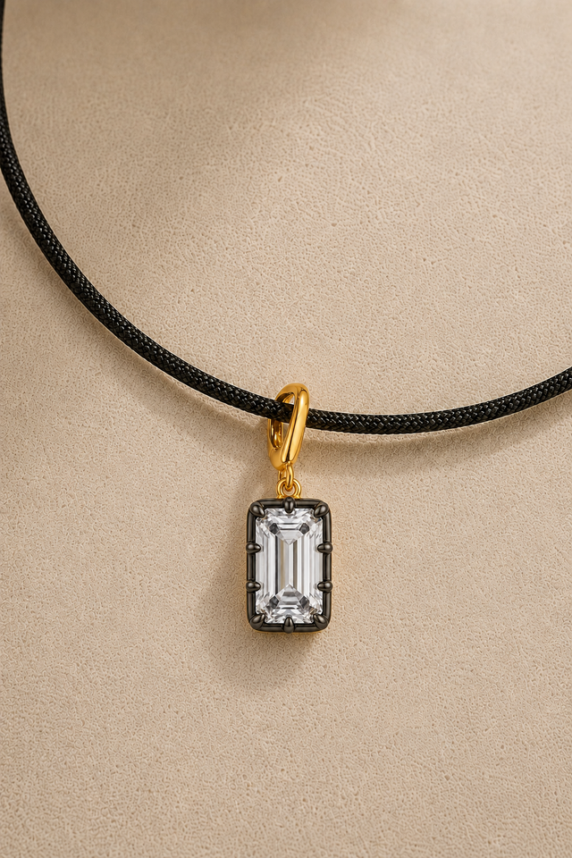 Vittoria emerald-cut hook charm in 24ct gold and black rhodium on adjustable black cord necklace – close-up