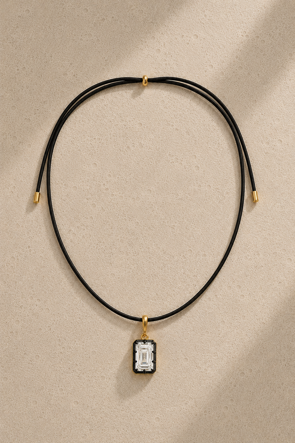Adjustable black cord necklace with Vittoria emerald-cut hook charm in 24ct gold and black rhodium – full view