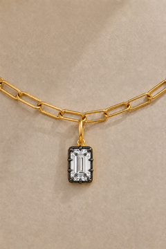 Close-up of Vittoria Emerald Cut black rhodium and gold hook charm on the gold Large Link chain