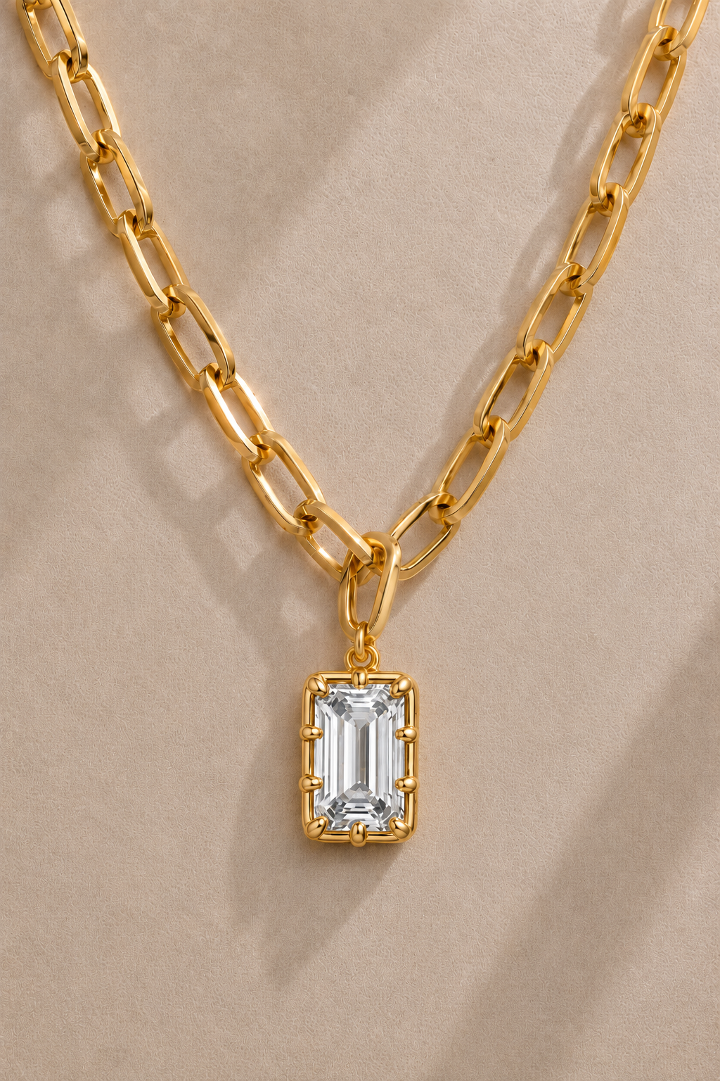 Vittoria Emerald Cut gold hook charm on the Cara gold plated chain necklace
