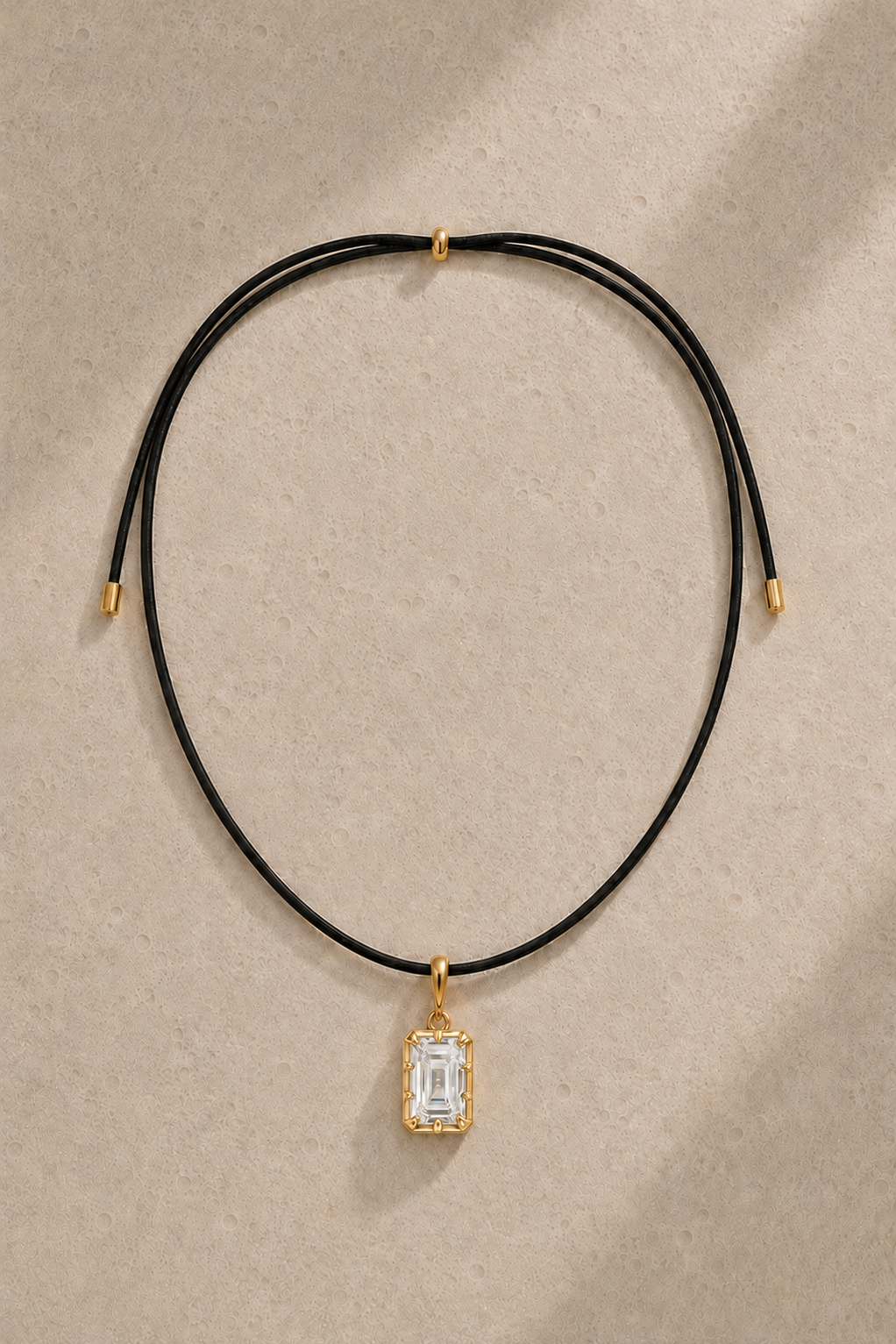 Adjustable black cord necklace with Vittoria emerald-cut 24ct gold plated hook charm – full view