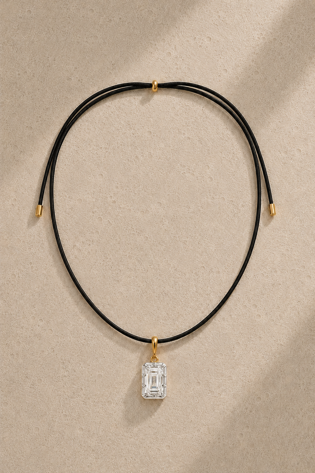 Adjustable black cord necklace with Vittoria emerald-cut silver and gold hook charm – full view