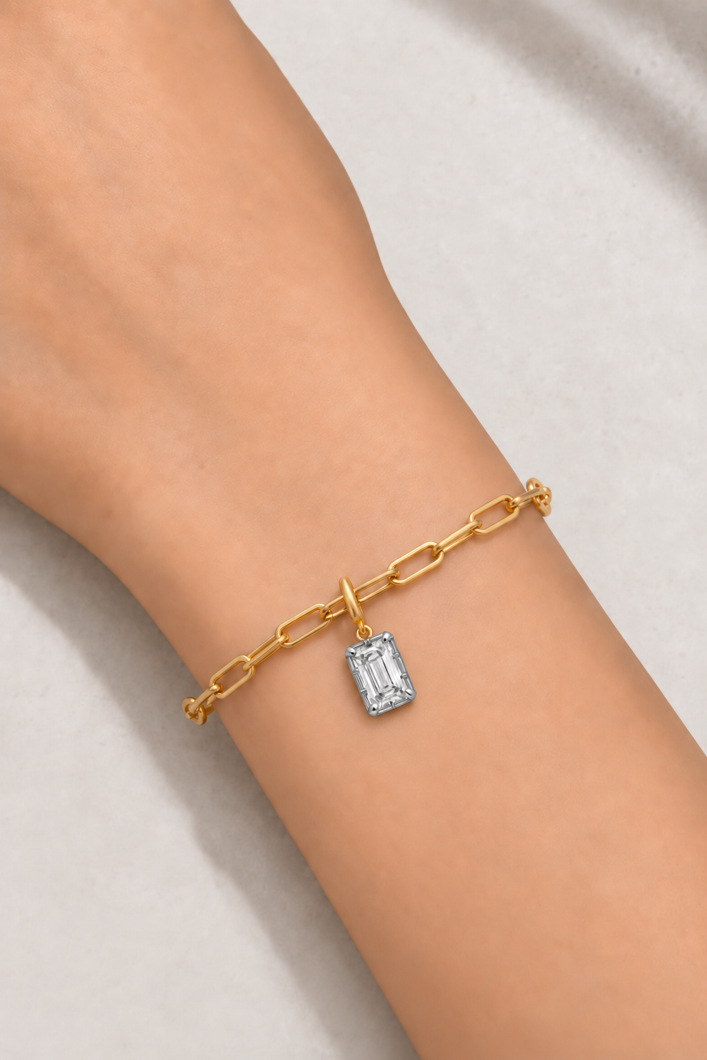 Vittoria Emerald Cut white rhodium and gold hook charm worn on the gold Large Link bracelet
